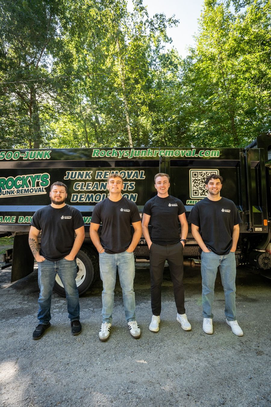 The four Rocky's Junk Removal guys in front of the dump truck