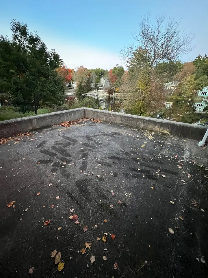 The same North Andover, MA driveway cleared to bare pavement after Rocky's Junk Removal loaded the renovation debris